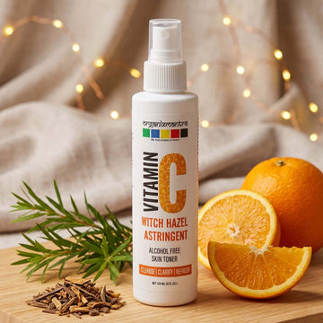 Organix Mantra Vitamin C Witch Hazel Astringent 120ml bottle with orange slices and tea tree sprig